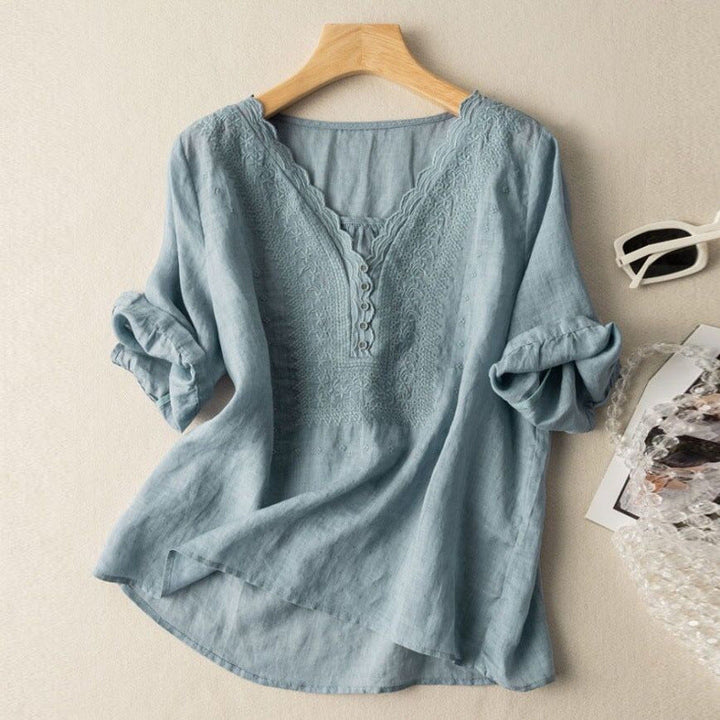Versatile women's button-up blouse with delicate embroidery. Chic, relaxed fit long sleeve top for casual & elegant looks.