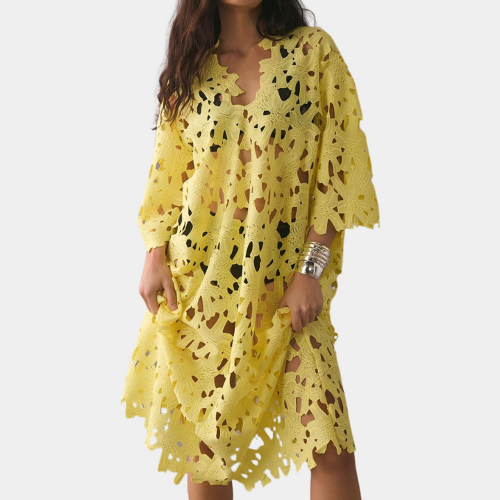Flowy summer midi dress for women, featuring intricate floral embroidery. Ideal for vacation wear & casual chic.