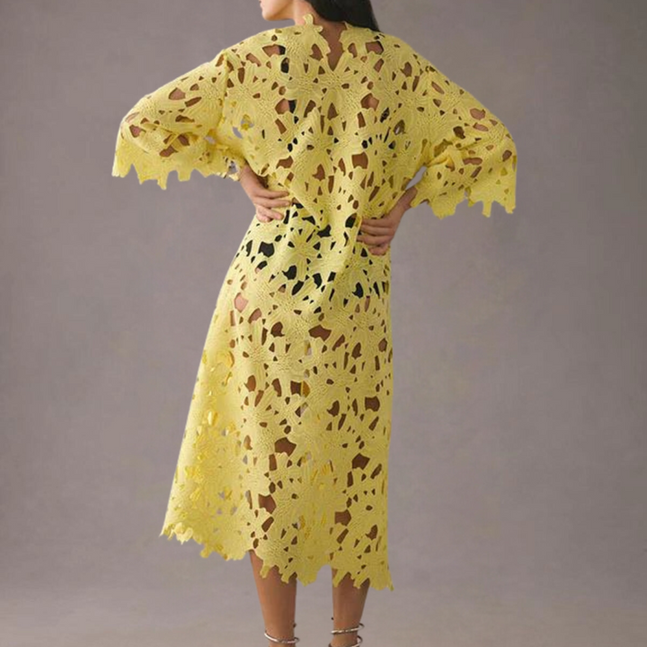 Chic women's midi dress with detailed floral embroidery, offering summer elegance & a comfortable flowy fit.