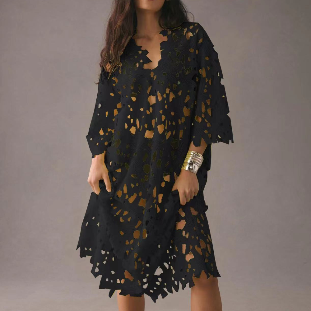 Embroidered women's midi dress, comfortable and flowy, with elegant floral patterns. Great for summer occasions.
