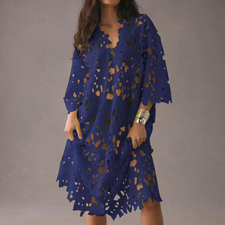 Light & airy women's midi dress, perfect for summer vacation, with charming floral embroidery & V-neck design.