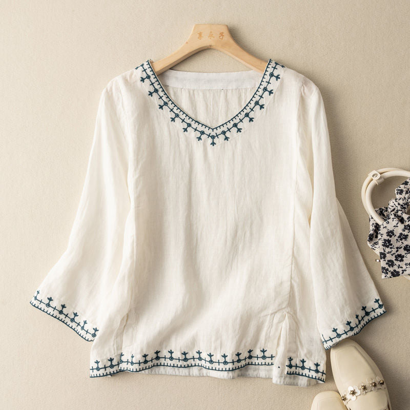 Elegant women's embroidered three-quarter sleeve blouse, perfect for spring/summer casual chic fashion.