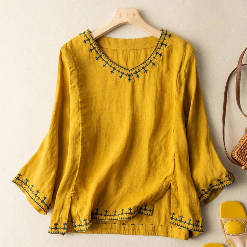 Airy casual chic women's embroidered top, featuring comfortable three-quarter sleeves for spring fashion.