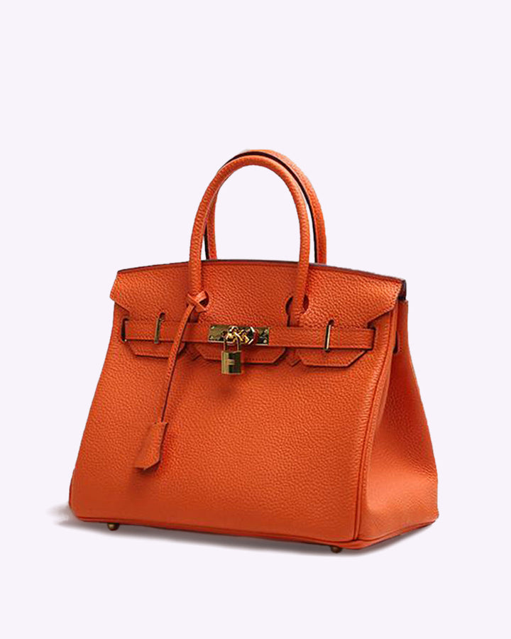 Elegant women's faux leather shoulder bag. Versatile vegan handbag, a stylish tote for daily use and modern looks.
