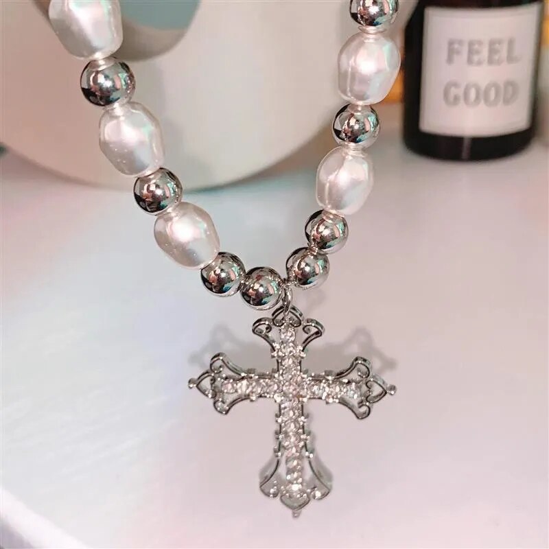 Elegant women's faux pearl cross pendant necklace, a timeless piece of delicate fashion jewelry for her.