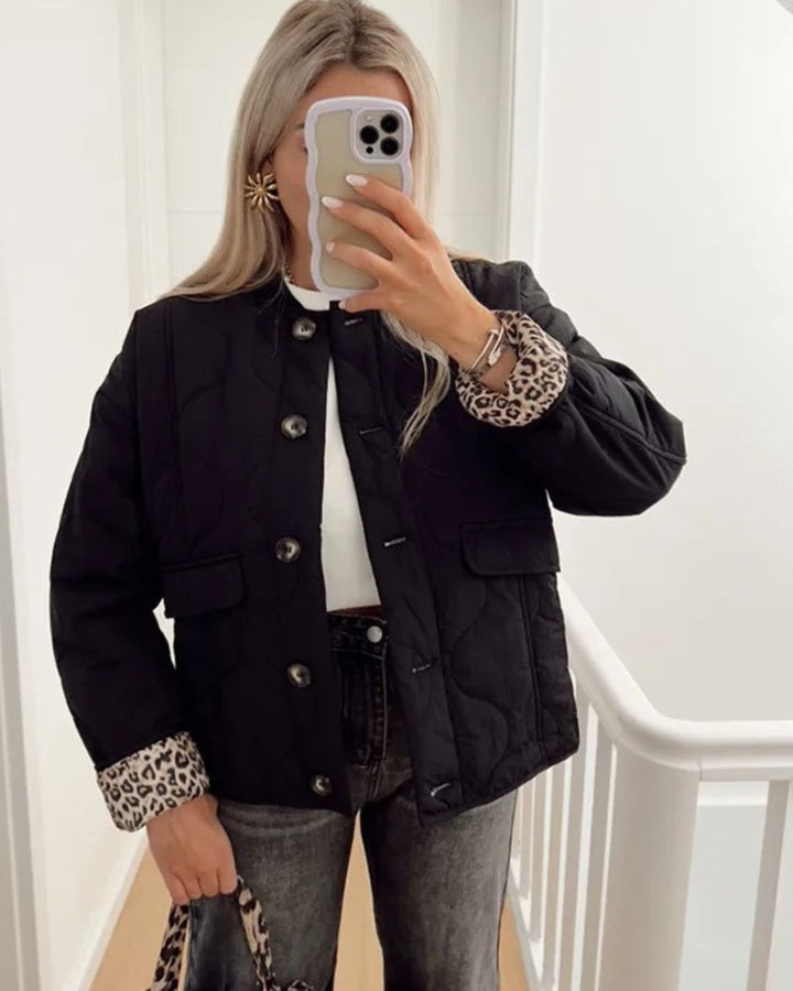 Elegant women's fitted jacket, Narela, with a subtle peek of leopard print lining, perfect for casual chic outfits.
