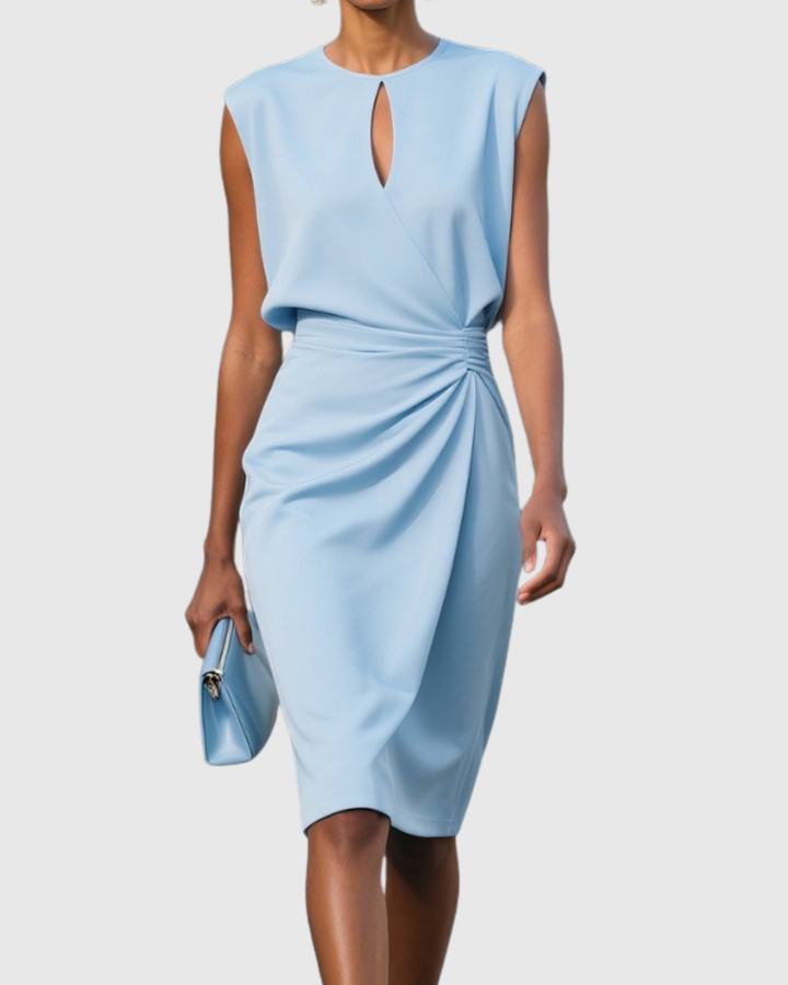 Close-up: Women's fitted midi dress featuring elegant side gathers, bodycon silhouette & flattering design.