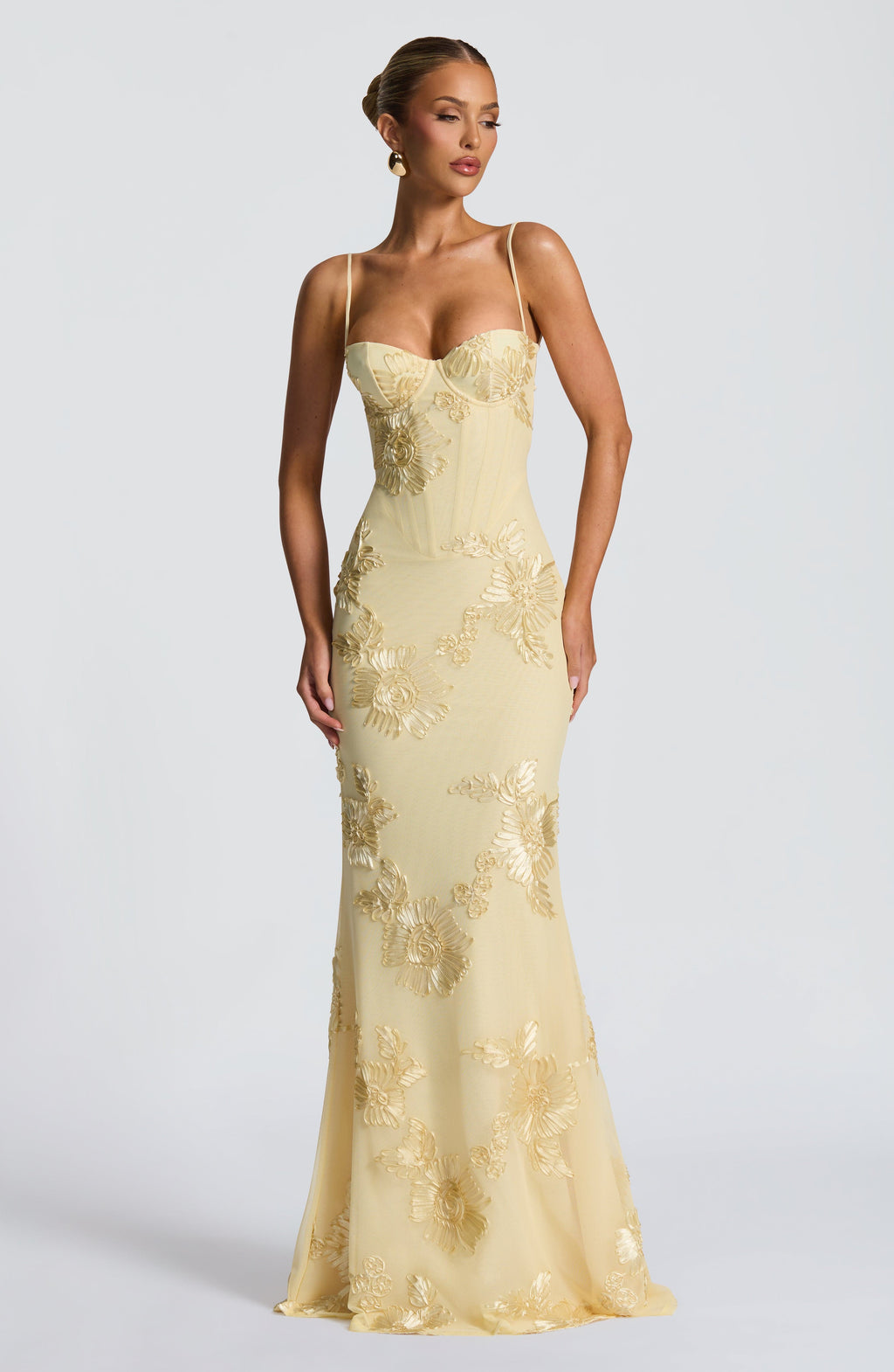 Sweetheart neckline floral appliqué mermaid maxi dress with spaghetti straps. Ideal for evening gowns.
