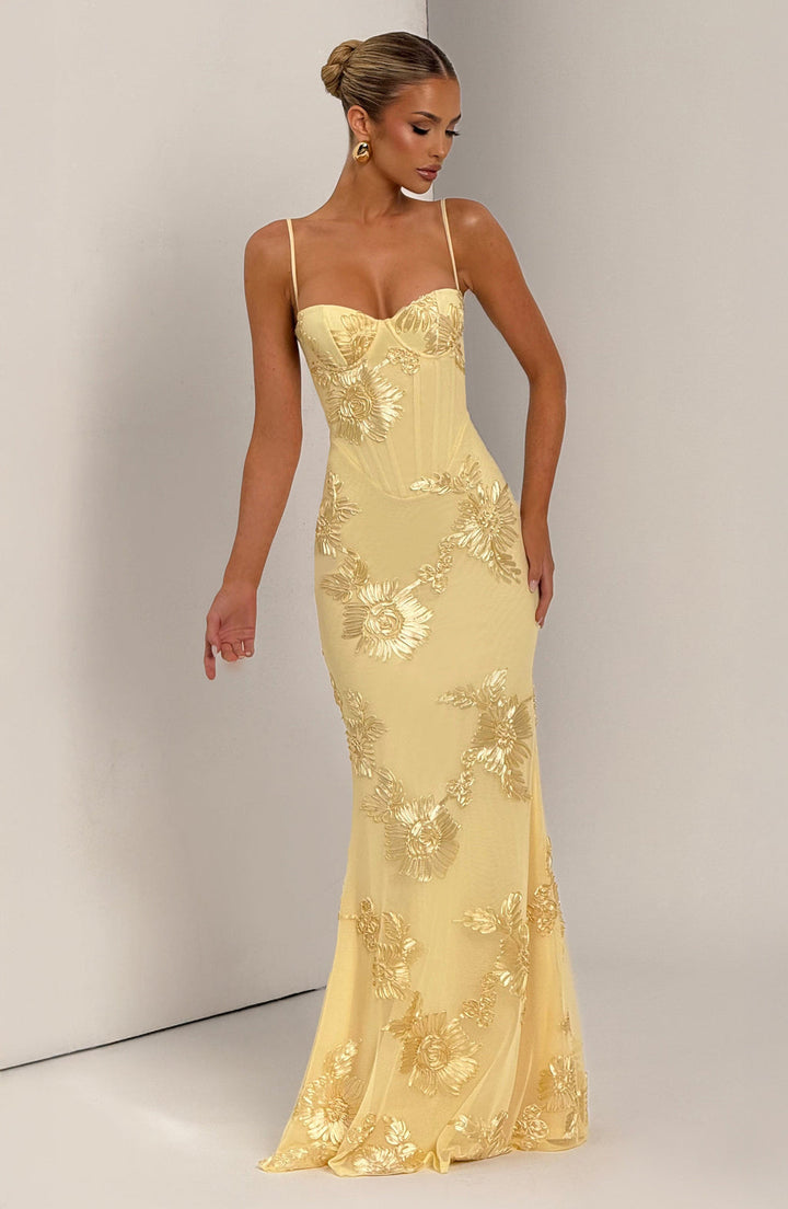 Detailed floral appliqué on elegant women's mermaid maxi dress. Ideal for formal evenings & prom.