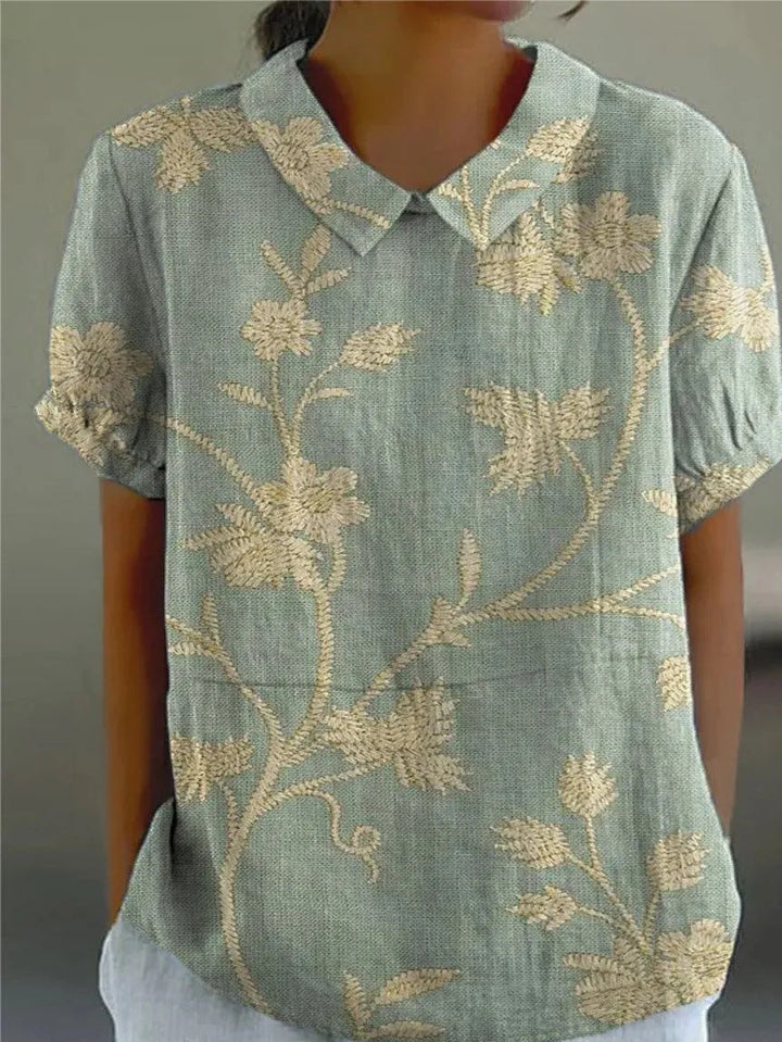 Elegant women's floral blouse with long sleeves, perfect for versatile fashion and spring-summer style.
