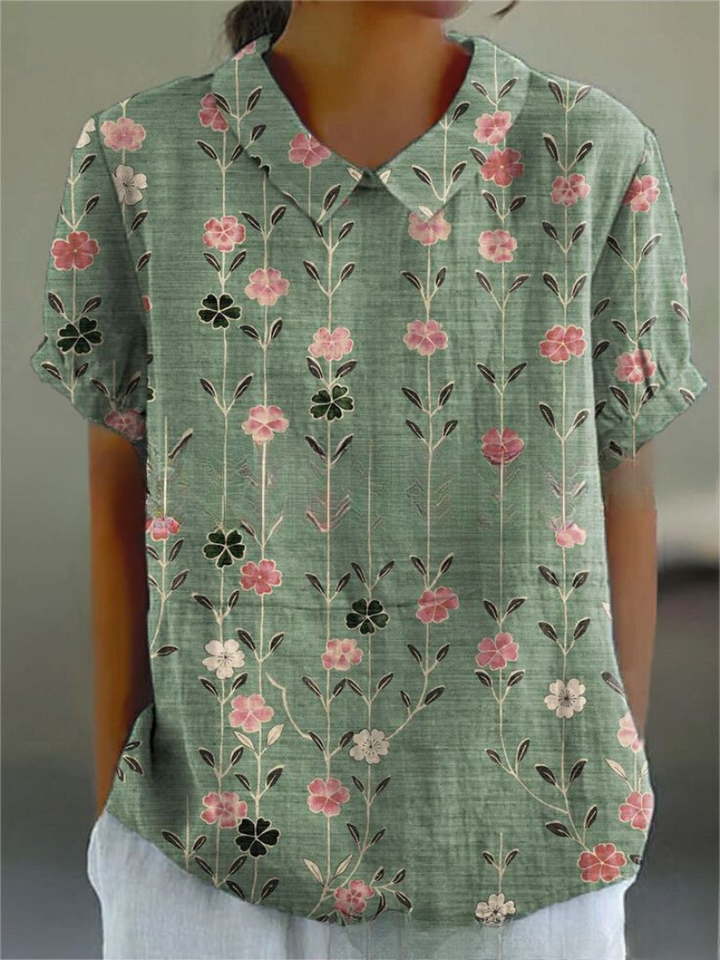 Graceful women's floral long sleeve blouse, a printed fashion top for elegant casual and spring styles.