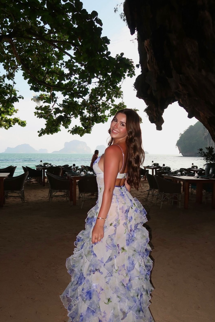 Sophisticated floral print maxi dress with a fitted corset and soft ruffles, a beautiful party dress.