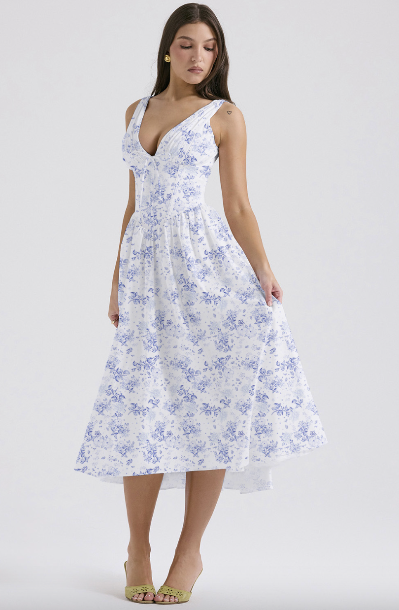 Women's A-line floral wedding guest dress. Features a stylish corset and v-neck. Elegant midi length.