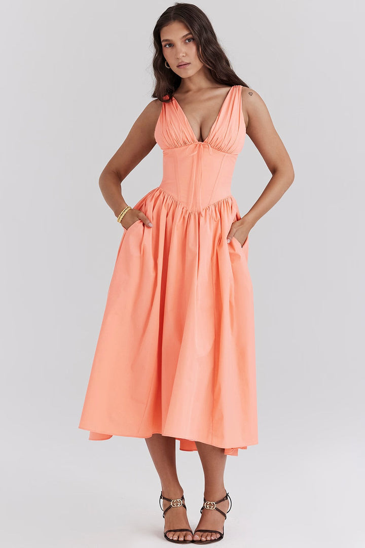 Summer floral midi wedding guest dress with a flattering corset, v-neck, and elegant a-line silhouette.