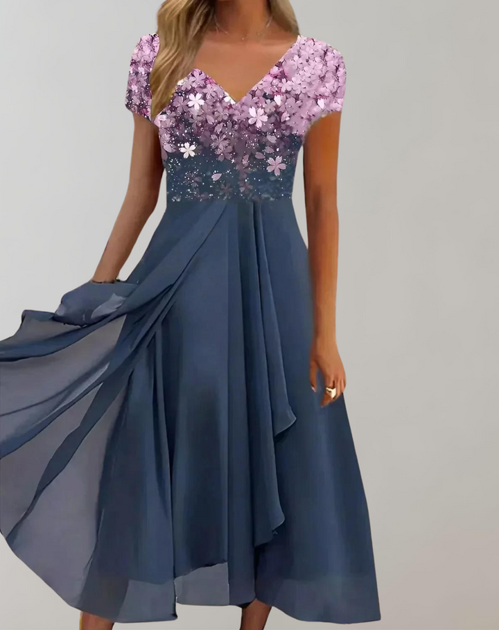 Luxurious women's midi dress, elegantly adorned with floral embellishments. Sophisticated choice for special events.