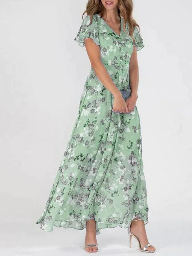 Feminine floral print maxi dress with V-neckline & delicate flutter sleeves. Ideal for parties & elegant summer wear.