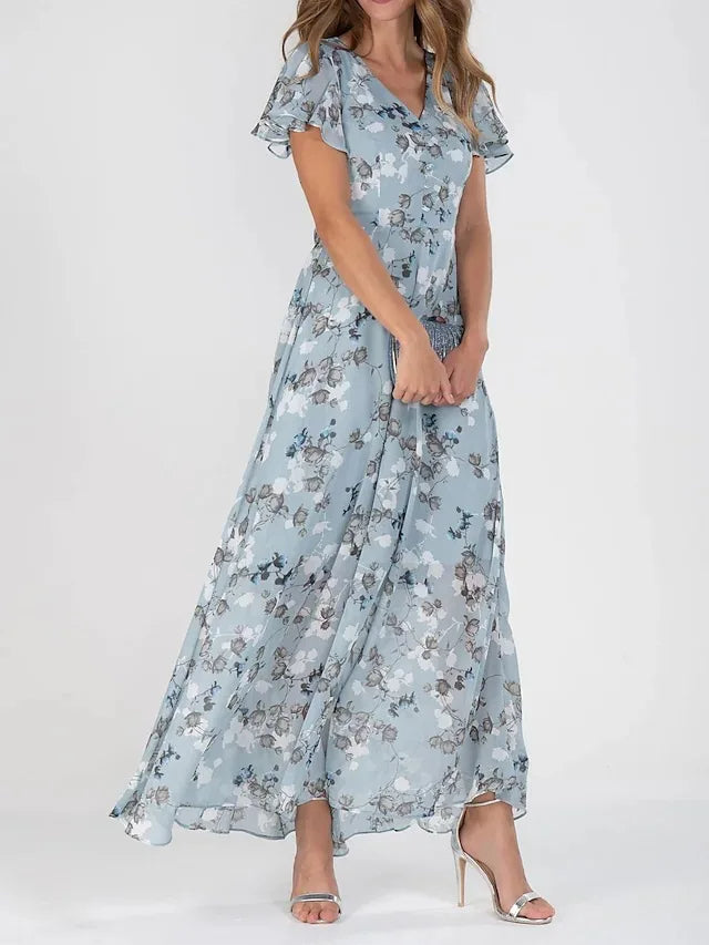 Long elegant women's maxi dress featuring a vibrant floral print, flattering V-neck, and chic flutter sleeves.