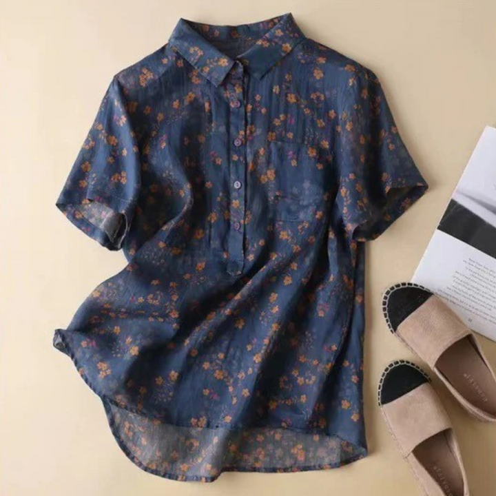 Relaxed fit women's floral blouse featuring a stylish half-placket and button-down front for versatile wear.