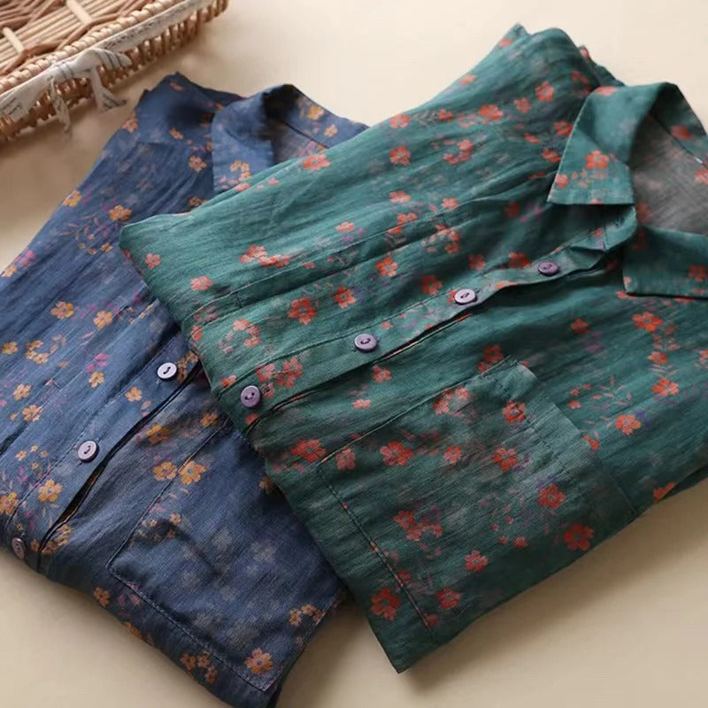 Chic women's summer floral top with an elegant half-placket and functional buttons, great for warm weather.