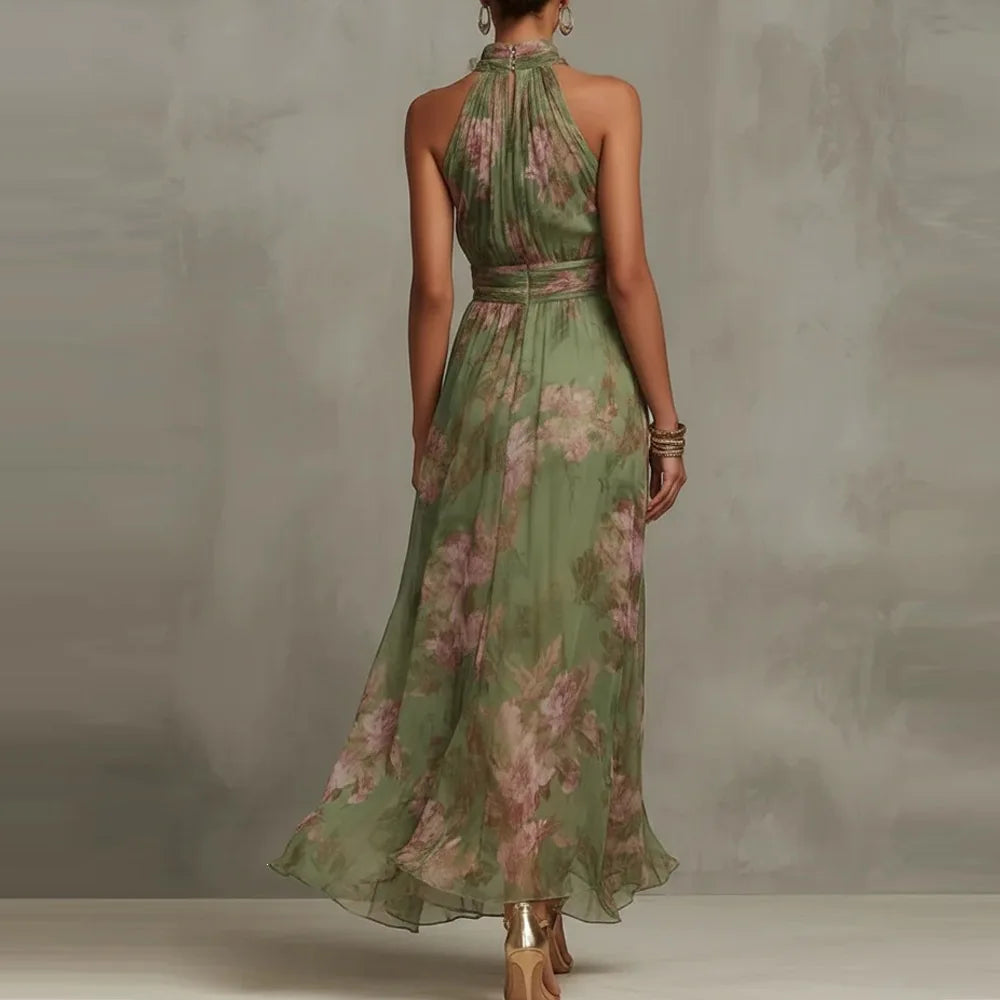 Vibrant floral print sleeveless maxi dress with a halter neckline, great for summer weddings or events.