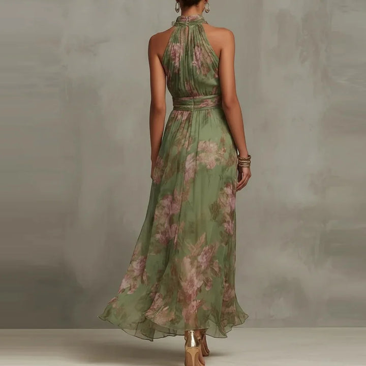 Vibrant floral print sleeveless maxi dress with a halter neckline, great for summer weddings or events.
