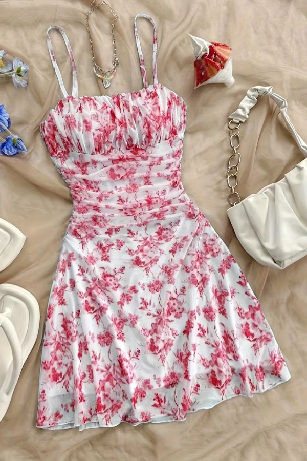 Chic red floral halter mini dress for women, featuring a flattering flared silhouette, ideal for vacation.