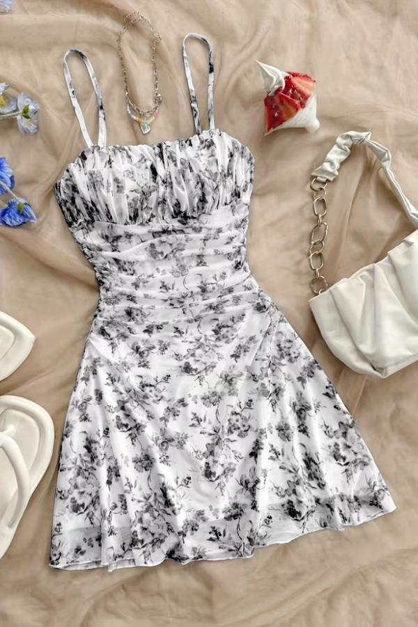 Stylish black floral halter mini dress with a flared fit, a perfect women's party dress or date night outfit.