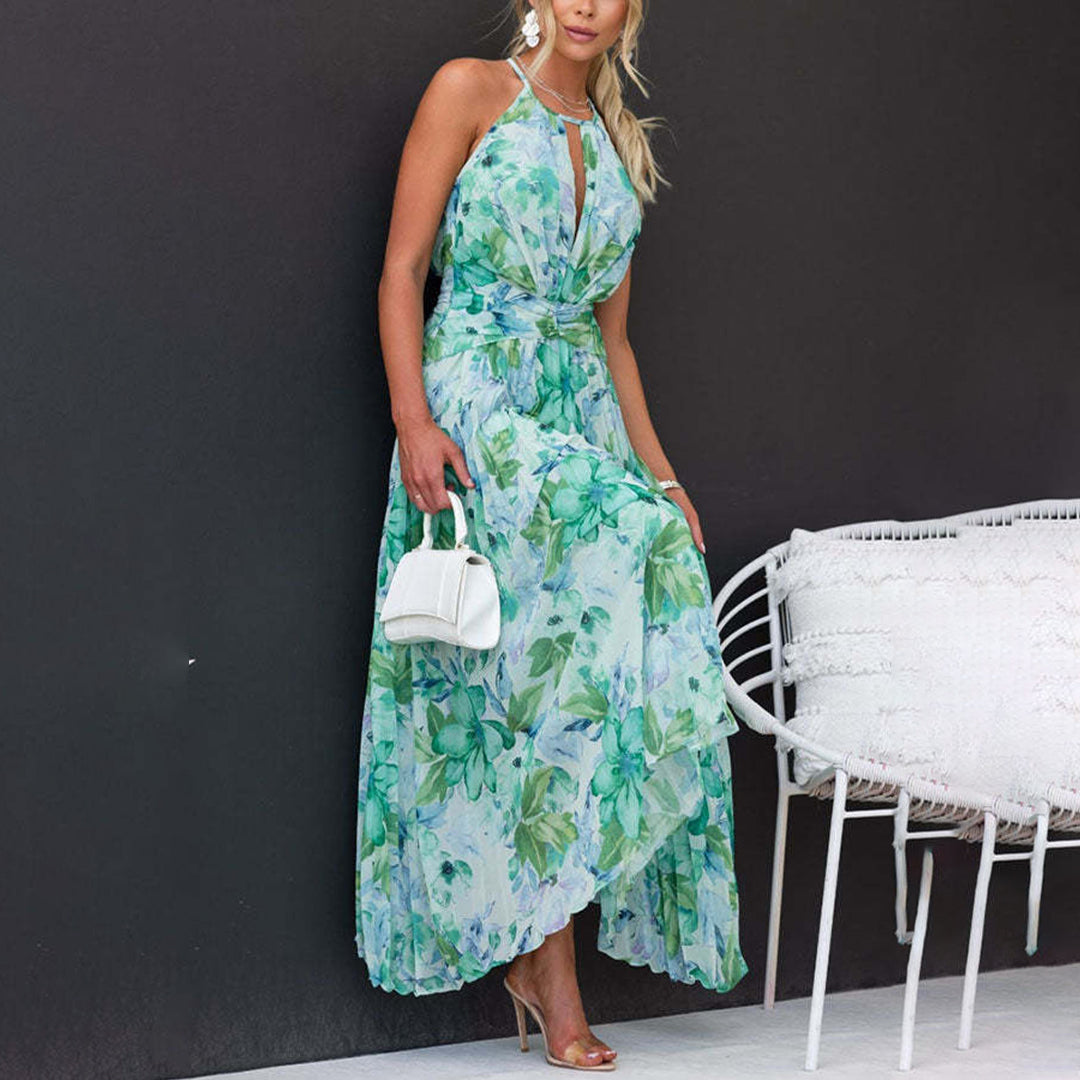 Women's maxi dress with floral print, halter neck, and elegant pleated skirt for weddings & events.