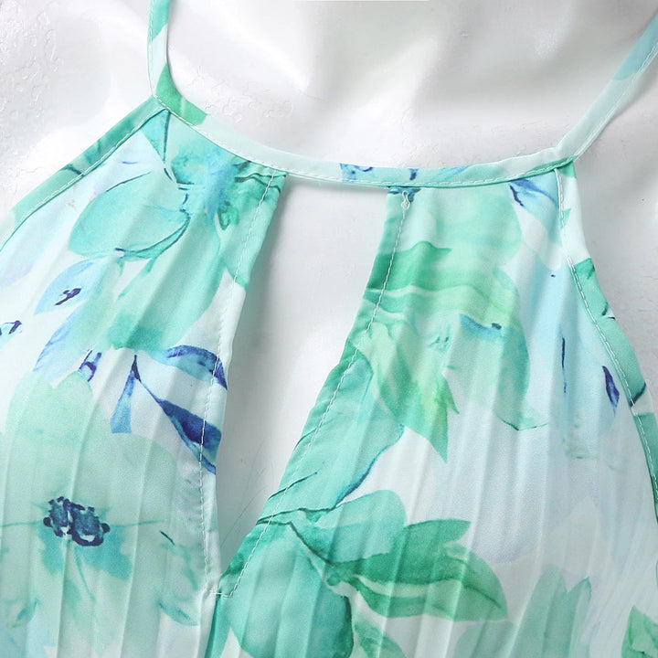 Chic women's pleated floral maxi dress with a sophisticated halter neckline, perfect for elegant gatherings.