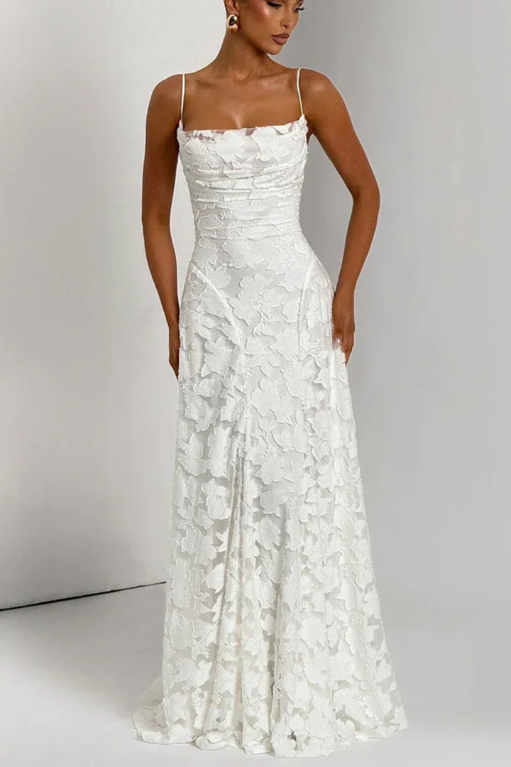 Close-up of the intricate floral jacquard fabric on the elegant women's maxi dress.