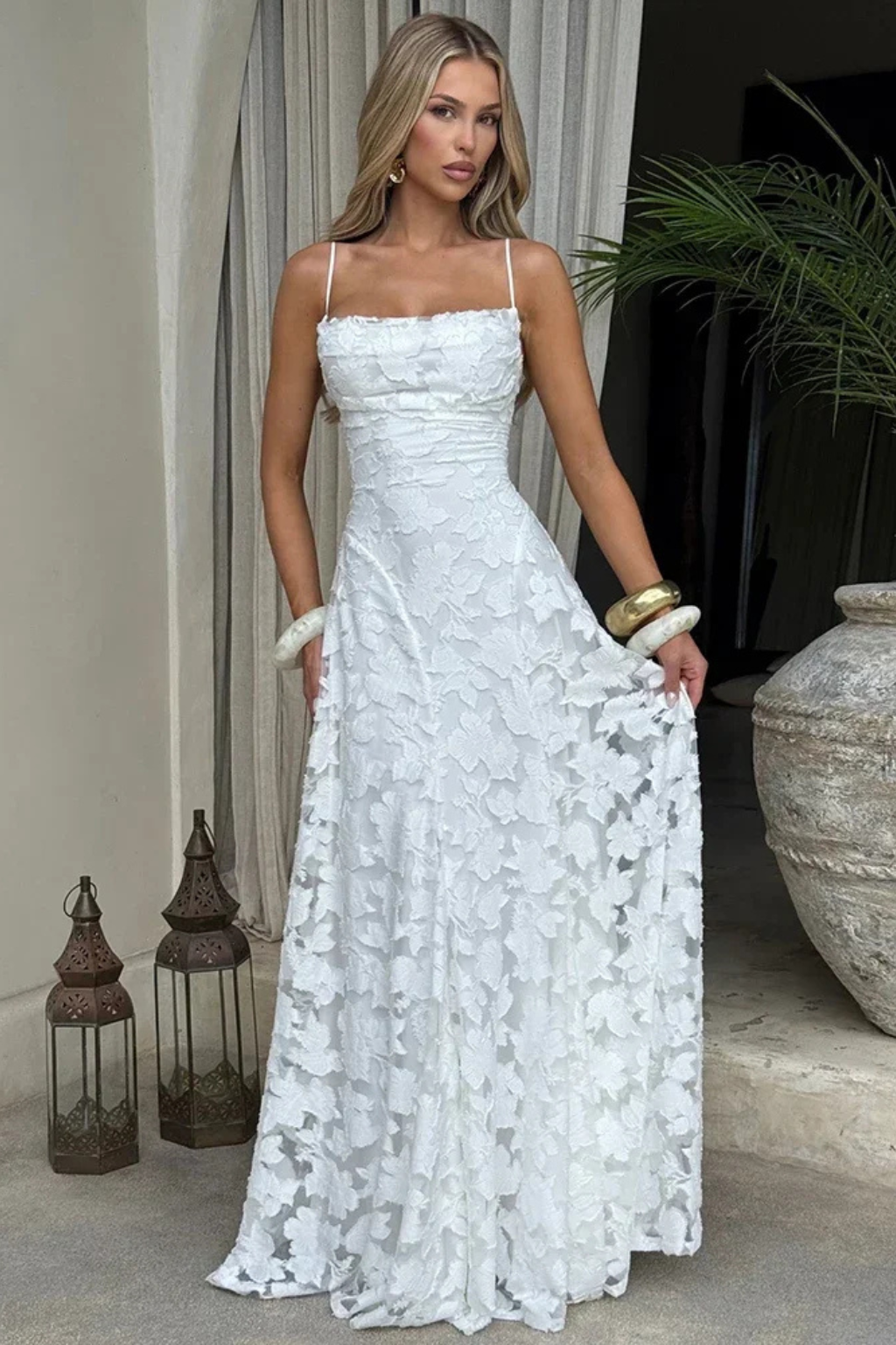 Detailed view of the stylish lace-up back on a women's floral jacquard maxi dress.