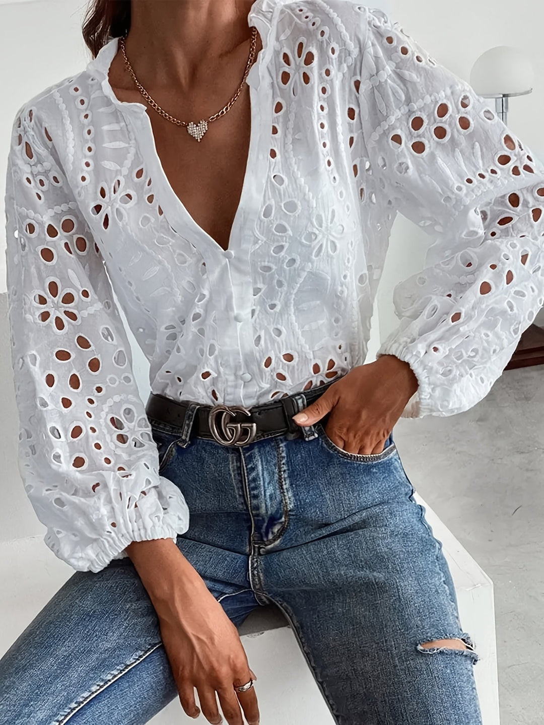 Elegant women's floral long-sleeve blouse with subtle embroidery, perfect for sophisticated style.