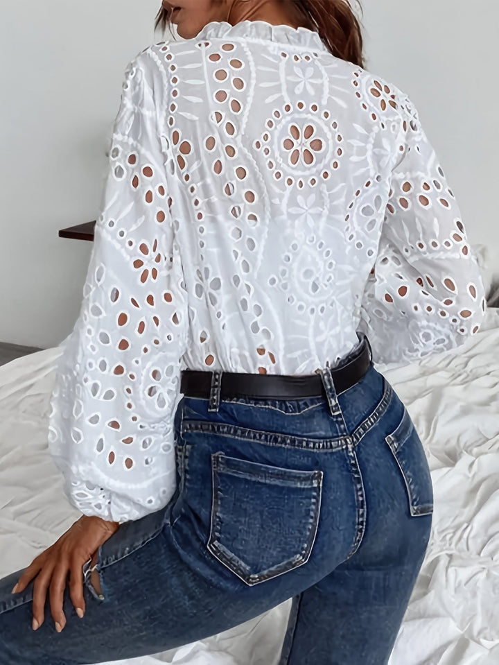 Embroidered floral long-sleeve blouse for women, featuring a classic button-front and elegant fit.