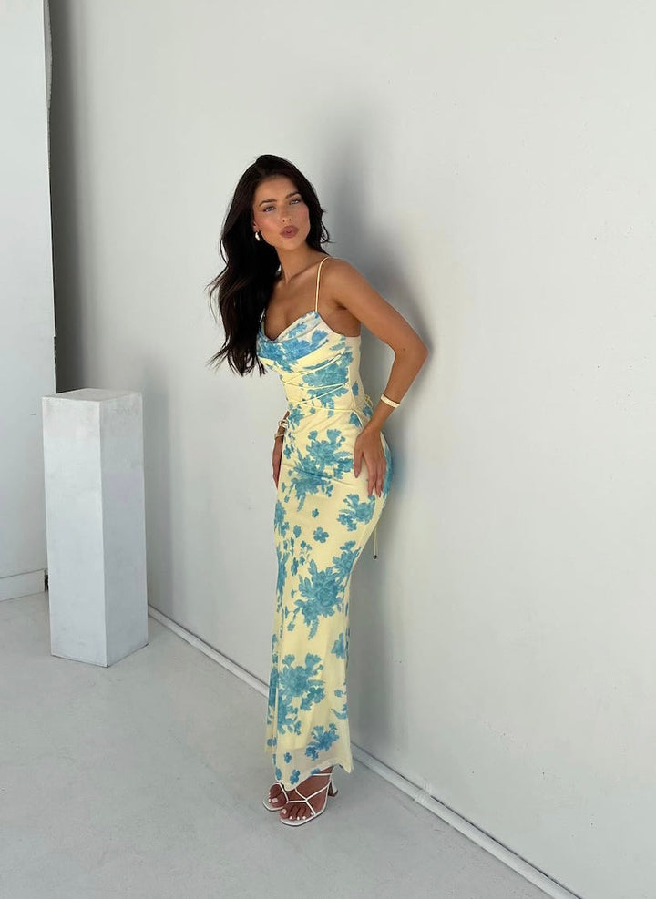 Elegant women's floral maxi dress, perfect wedding guest attire or summer occasion wear. Sleeveless & stylish.