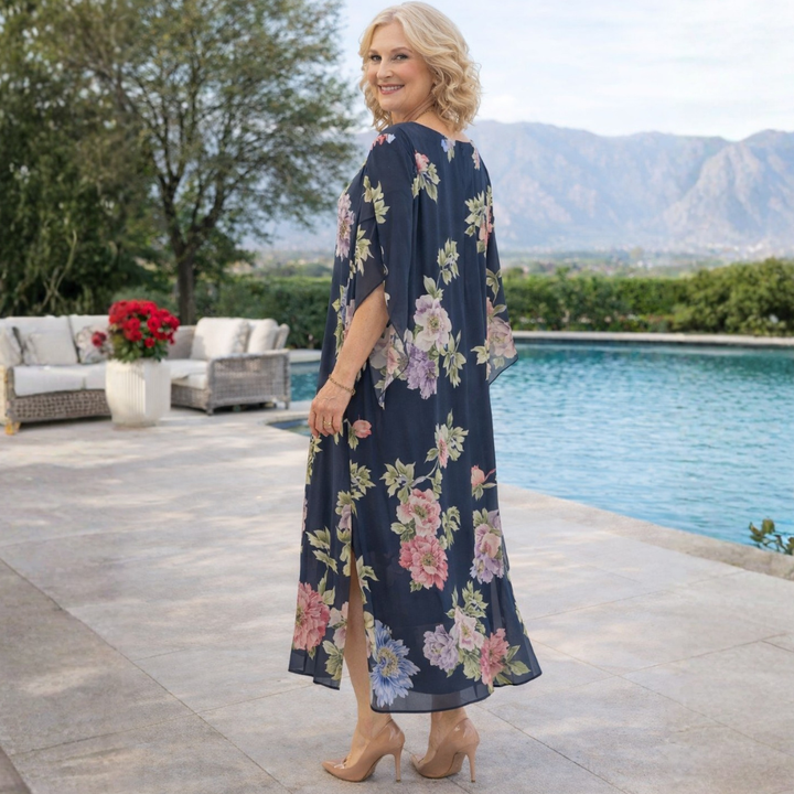Close-up of a women's floral maxi dress showing delicate print & soft, flowy fabric. Ideal for all-day comfort.