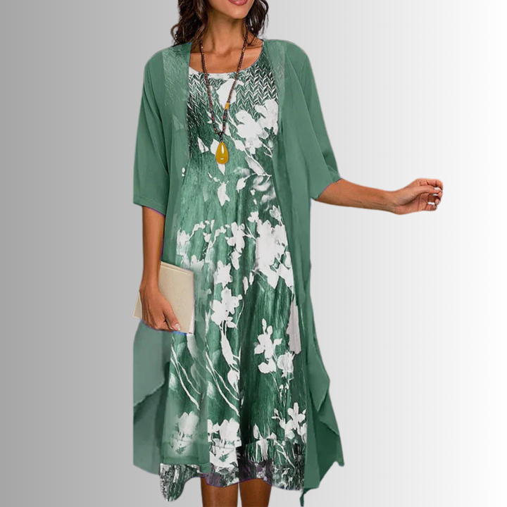 Elegant women's floral midi dress and matching cardigan set for a sophisticated spring or summer look.