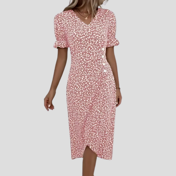 Feminine v-neck floral midi dress with short sleeves and full button front. Versatile for casual or elegant events.