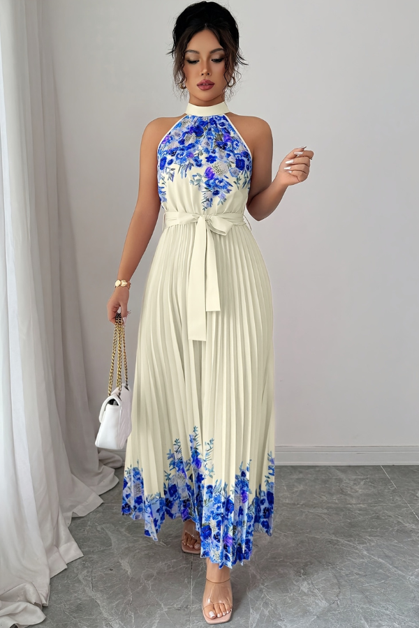 Close-up of the delicate fabric and intricate floral pattern of this pleated midi dress for women.