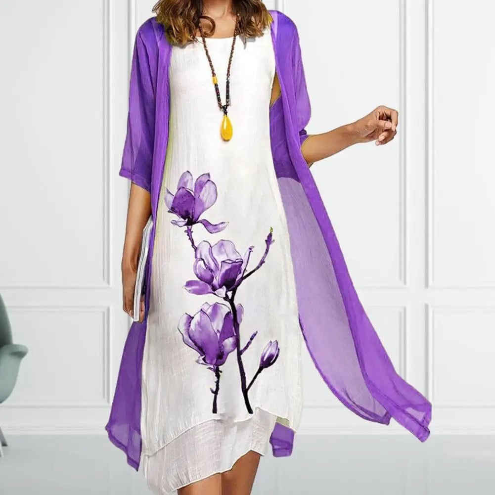 Sophisticated women's scoop neck floral midi dress and sheer cardigan set. Casual chic layered fashion, ideal for summer.