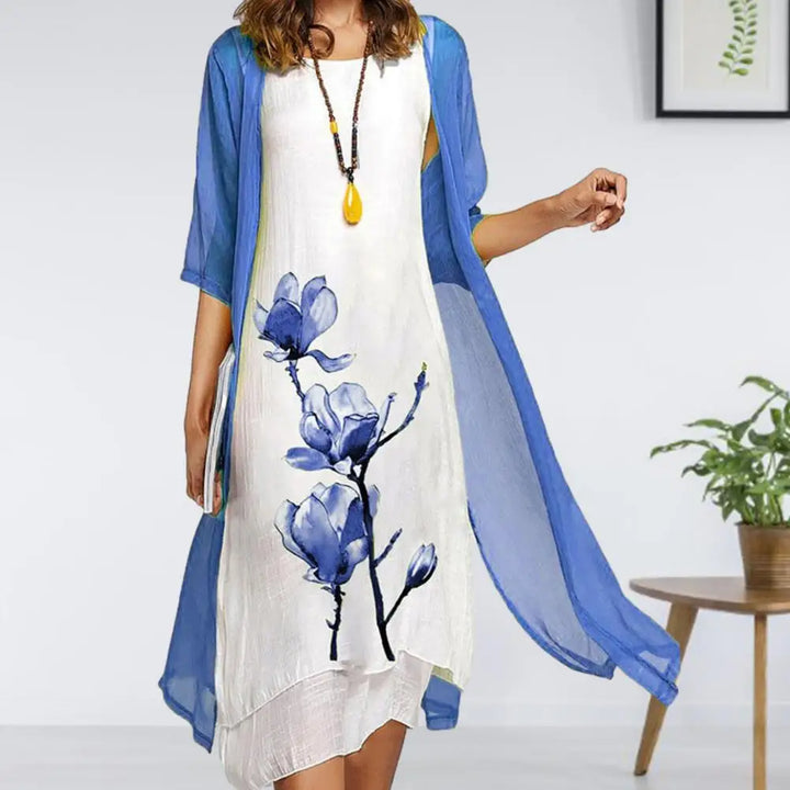 Women's two-piece floral midi dress with a delicate sheer cardigan. Elegant and versatile spring/summer outfit for women.
