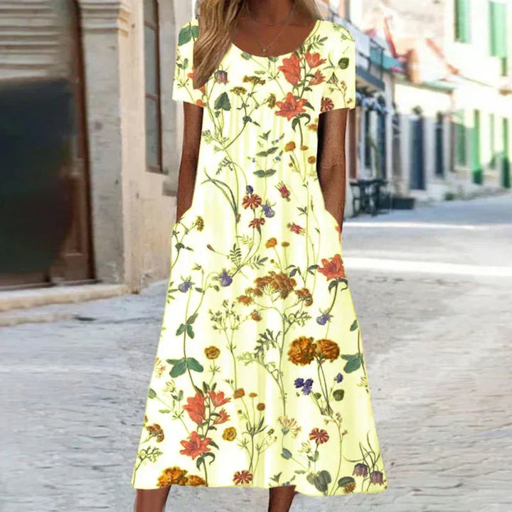 Chic summer floral midi dress for women, featuring short sleeves and an elegant, comfortable design.