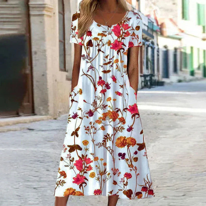 Vibrant floral print short sleeve midi dress for women, a stylish and comfortable choice for summer.