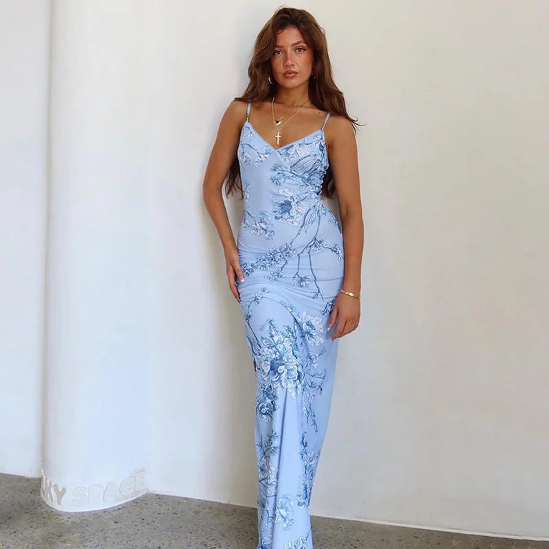 Elegant women's floral print V-neck spaghetti strap maxi dress, perfect for summer fashion and beachwear.