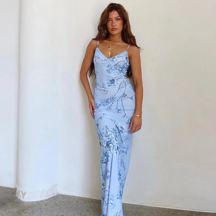 Elegant women's floral print V-neck spaghetti strap maxi dress, perfect for summer fashion and beachwear.