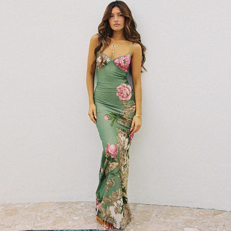 Beautiful women's floral print maxi dress with a V-neckline and spaghetti straps, great for beach or party.