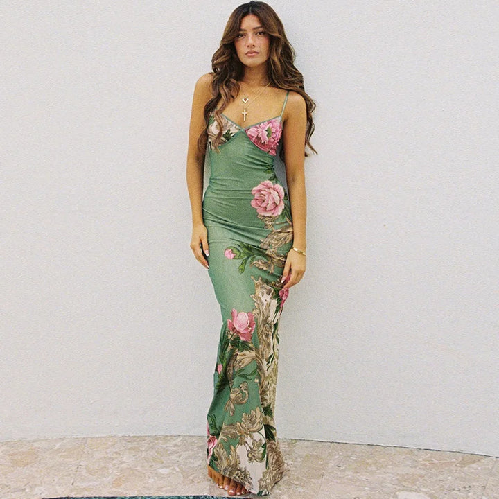 Beautiful women's floral print maxi dress with a V-neckline and spaghetti straps, great for beach or party.