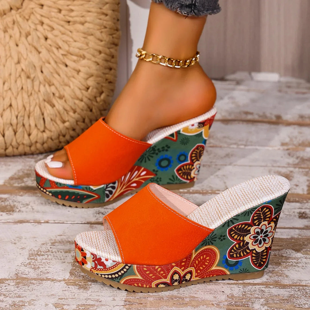 Women's comfortable slip-on wedge sandals with elegant floral print for summer fashion.