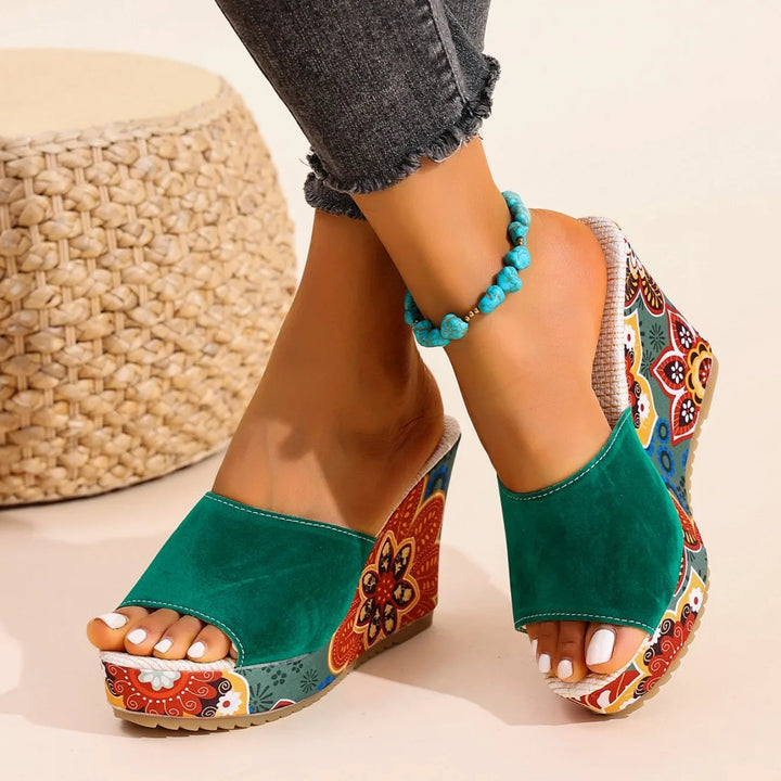 Comfortable women's wedge sandals with artistic floral print, ideal for elegant summer fashion.
