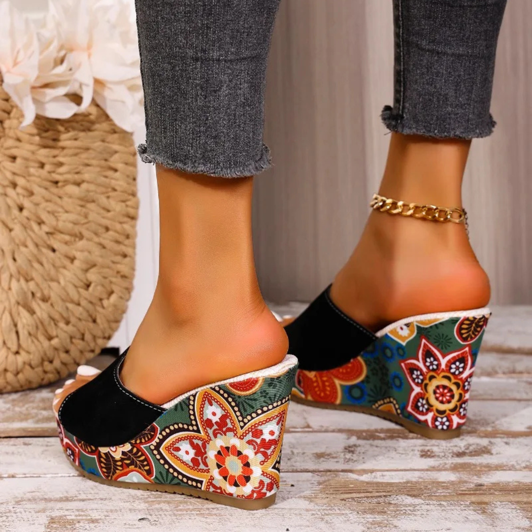 Beautiful women's floral wedge sandals, a comfortable slip-on design with artistic elegance.