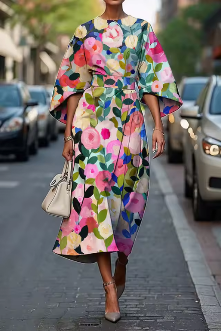 Elegant women's floral summer midi dress. Flowy design with vibrant print, perfect for spring/summer parties.
